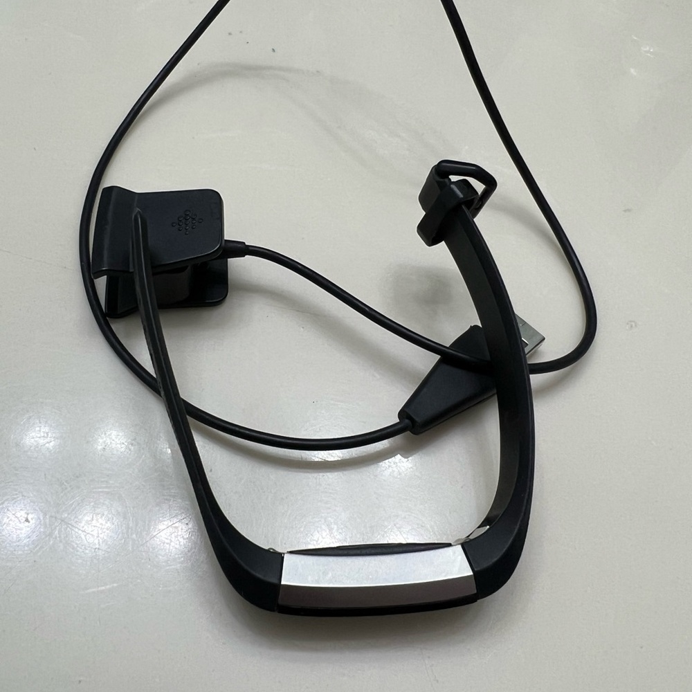 Fitbit Black and Pink Fitness Trackers